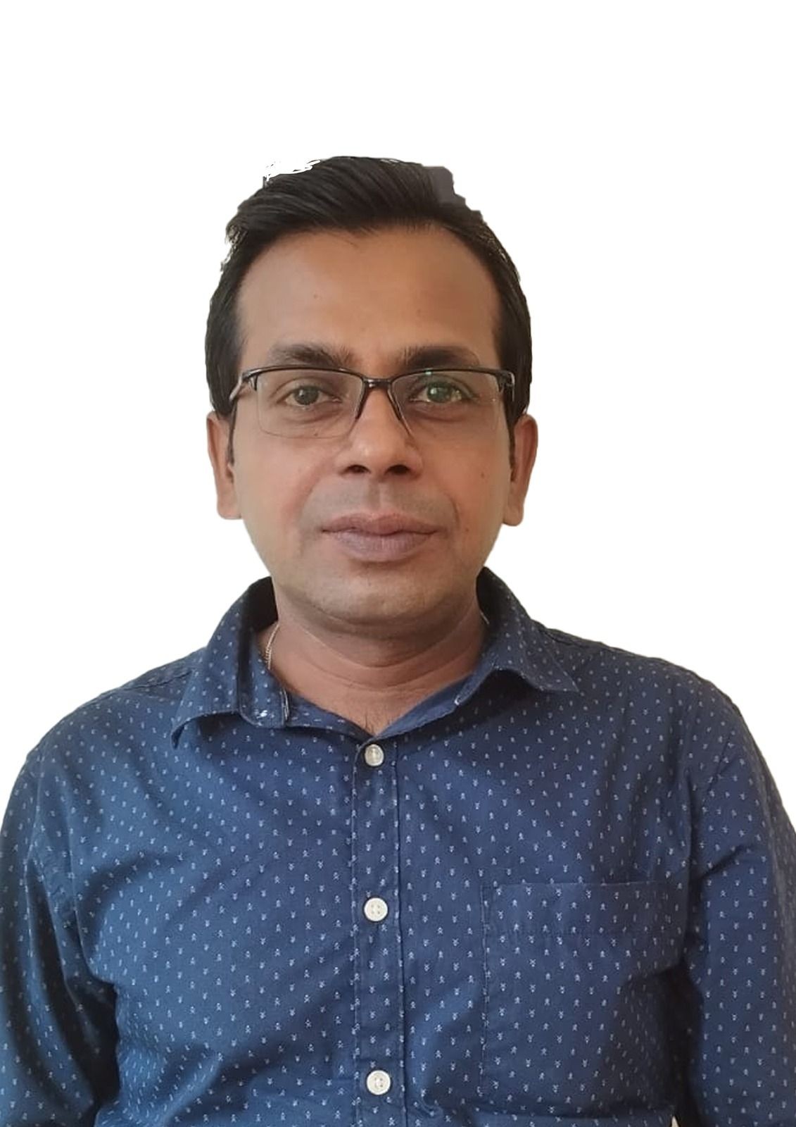 Person wearing a blue patterned shirt, facing the camera.